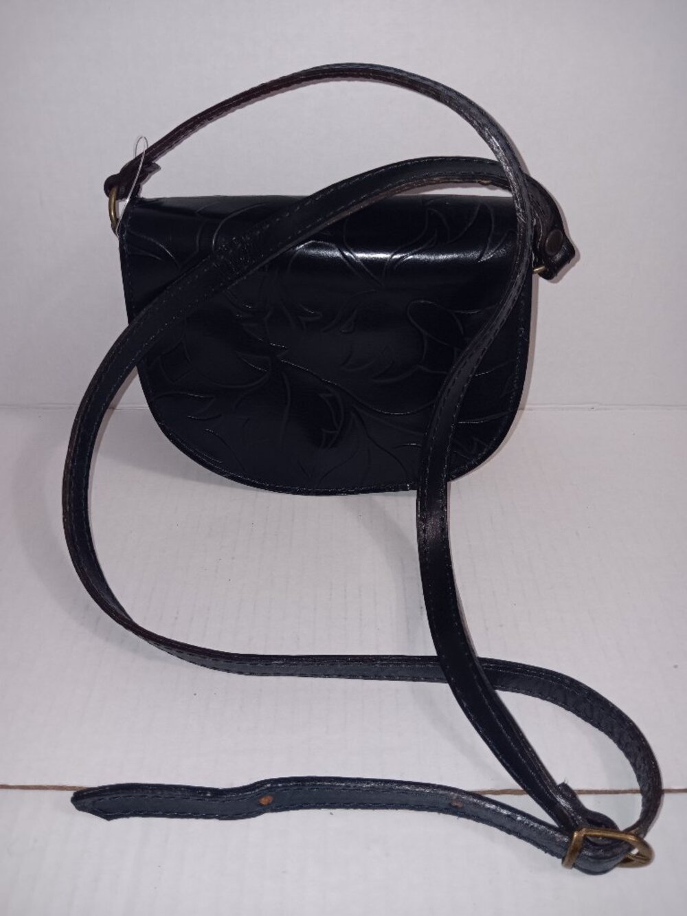 FIRENZE ITALIAN LEATHER DARK BLUE FLORAL EMBOSSED PATTERN CROSSBODY BAG
